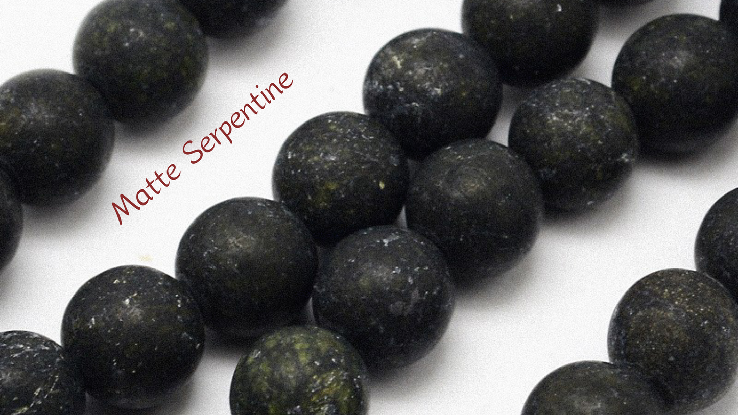 Close-up of natural serpentine stone beads from Aking Sinta Matte Serpentine Stretch Bracelet, showcasing texture, colour, and craftsmanship