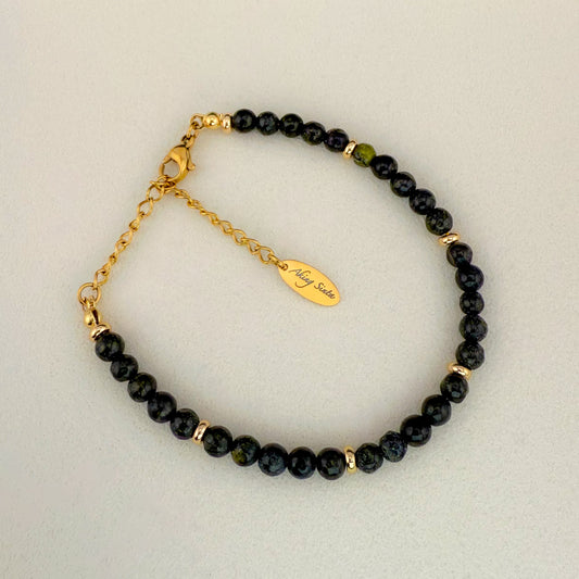 A minimalist Aking Sinta Serpentine beaded bracelet without a charm, featuring translucent lime and olive green gemstones with soft natural clouding; finished with a gold extender chain and a teardrop tag engraved with "Aking Sinta."