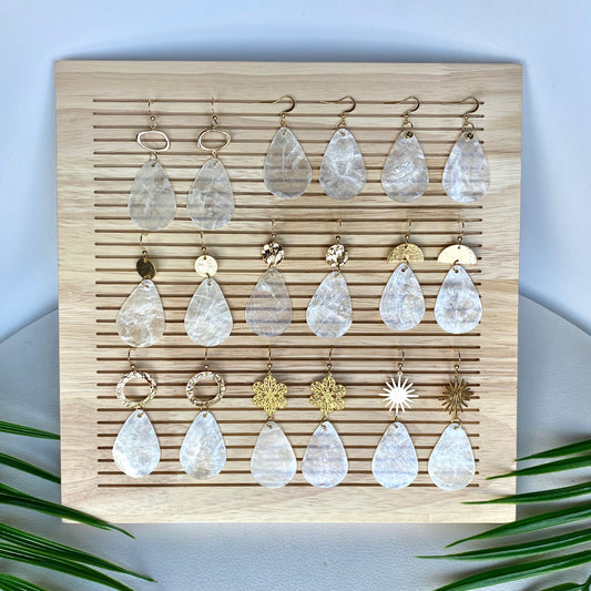 Collection of Teardrop Capiz Shell Earrings showing all charm variants – brushed circle, hammered, sun, floral, and plain styles