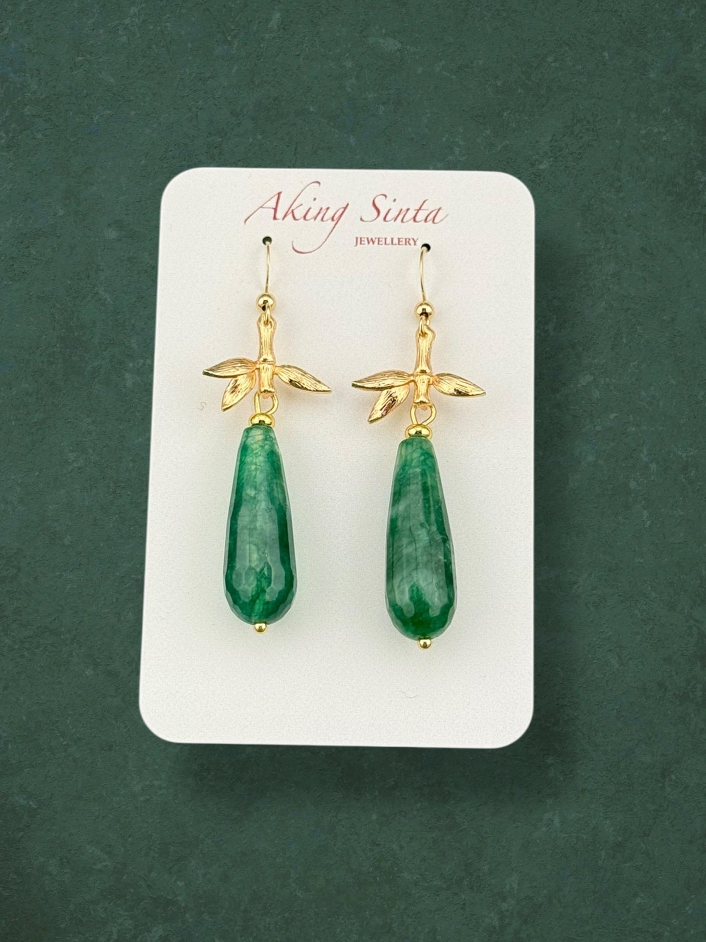 Teardrop dark green jade earrings with bamboo leaf charms in gold plated stainless steel, elegant natural gemstone jewellery