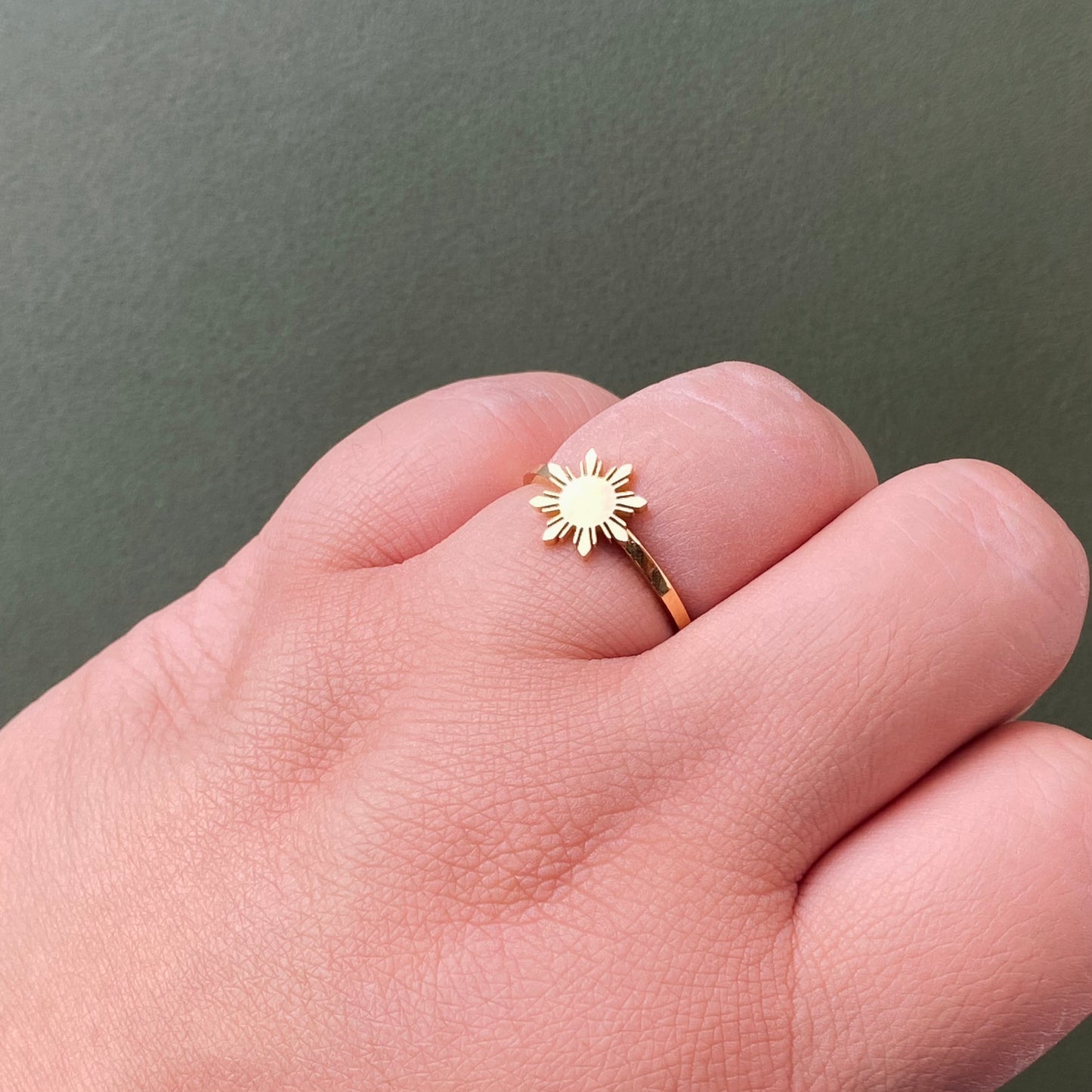 Aking Sinta Araw Adjustable Ring in gold worn on ring finger, highlighting elegant 8-ray sun motif and modern Filipino design