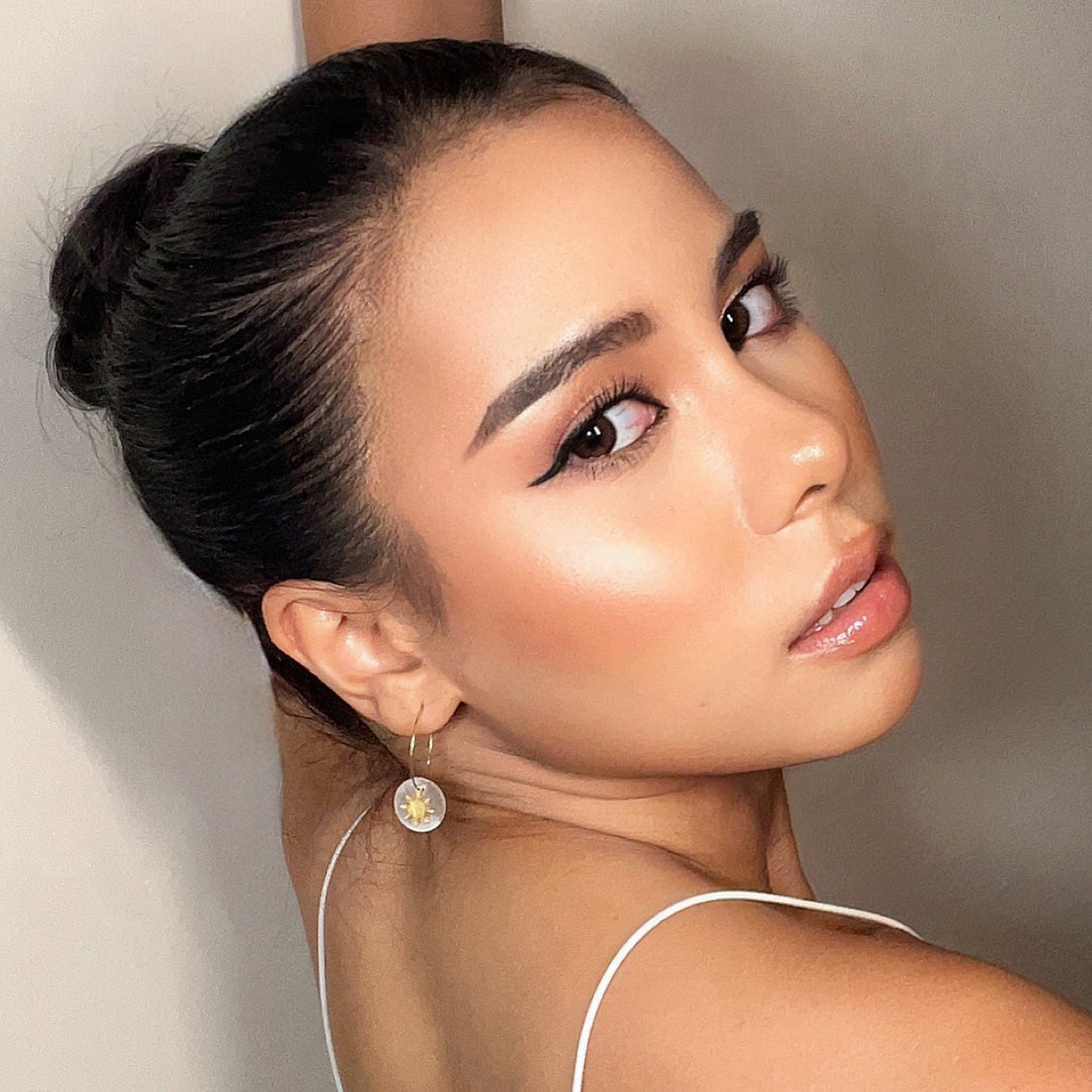 Aking Sinta Araw and Capiz Shell Dainty Hoop Earrings worn by model, focused on ears, highlighting lightweight design and Philippine-inspired craftsmanship