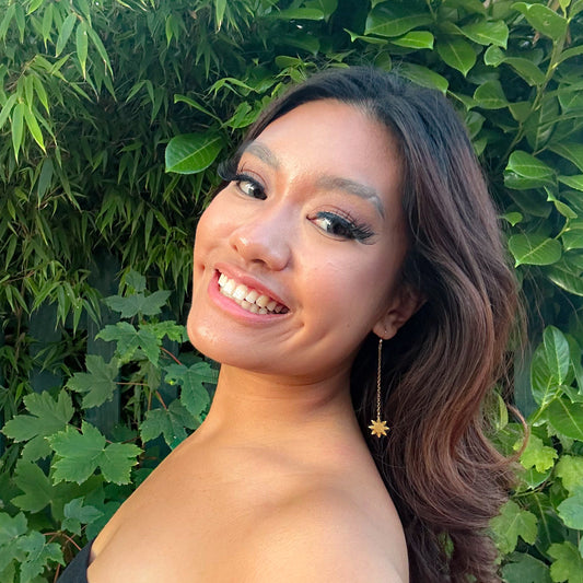 Aking Sinta Araw Hook Earrings featuring 8-ray sun charms worn by a gorgeous model, highlighting lightweight design and Philippine-inspired craftsmanship