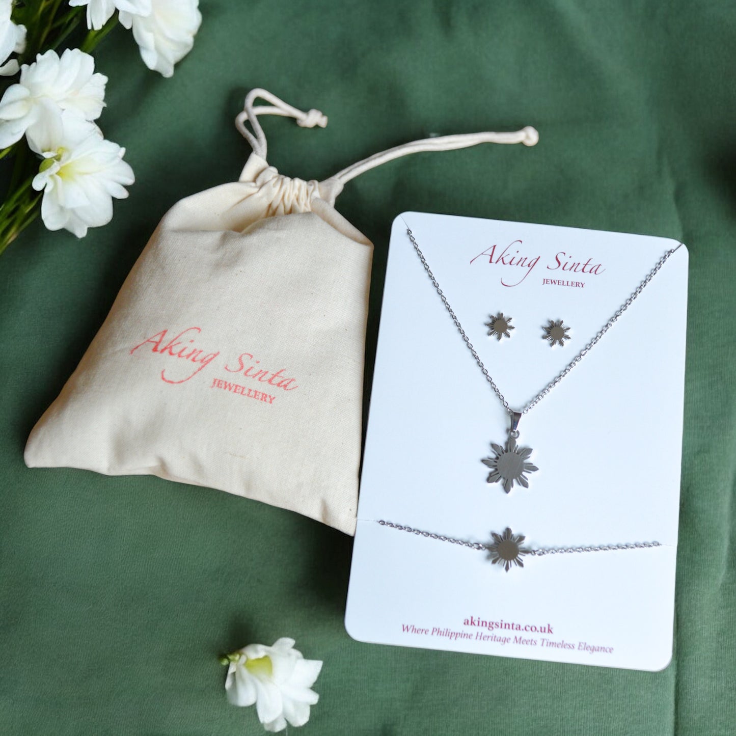 Aking Sinta Araw jewellery set in silver displayed on branded cardboard jewellery holder with drawstring pouch, showcasing Philippine-inspired gift packaging