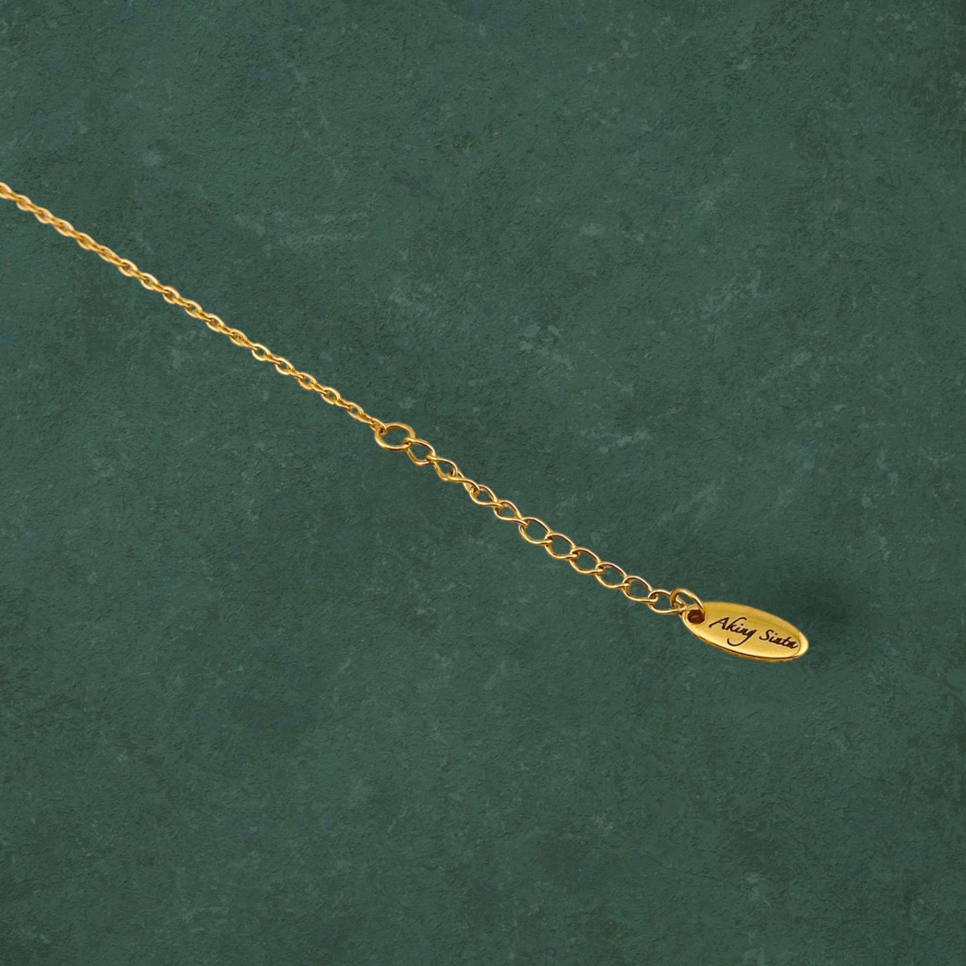 Aking Sinta Araw Minimalist Anklet gold extender showing engraved clasp with Aking Sinta branding, highlighting adjustable design and refined craftsmanship