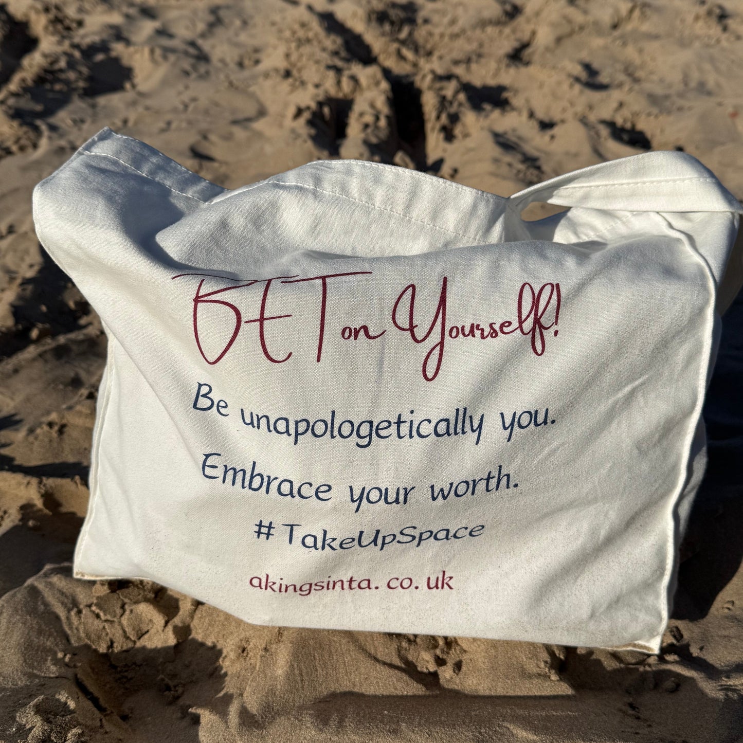Back of Aking Sinta ‘BET on Yourself’ Floral Tote Bag showing empowering words: ‘BET; Be an unapologetically You. Embrace your worth #takeupspace’ on clean background