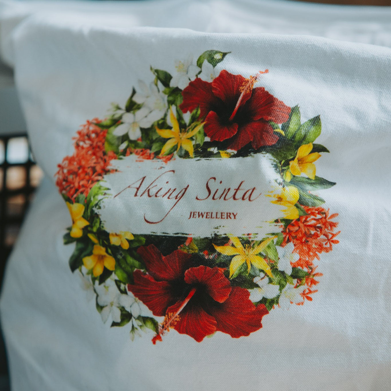 Close-up of Philippine-inspired floral print on Aking Sinta ‘BET on Yourself’ Tote Bag, featuring gumamela, yellow bell, santan, sampaguita, and ilang-ilang flowers