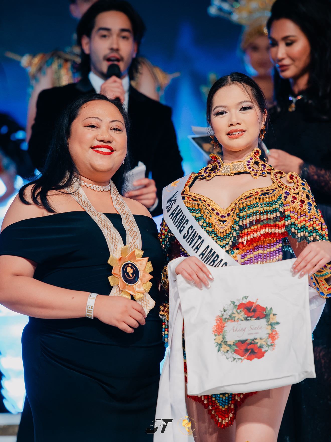 Founder of Aking Sinta with pageant model holding ‘BET on Yourself’ Floral Tote Bag, showcasing Philippine-inspired blooms and empowering mantra in lifestyle setting