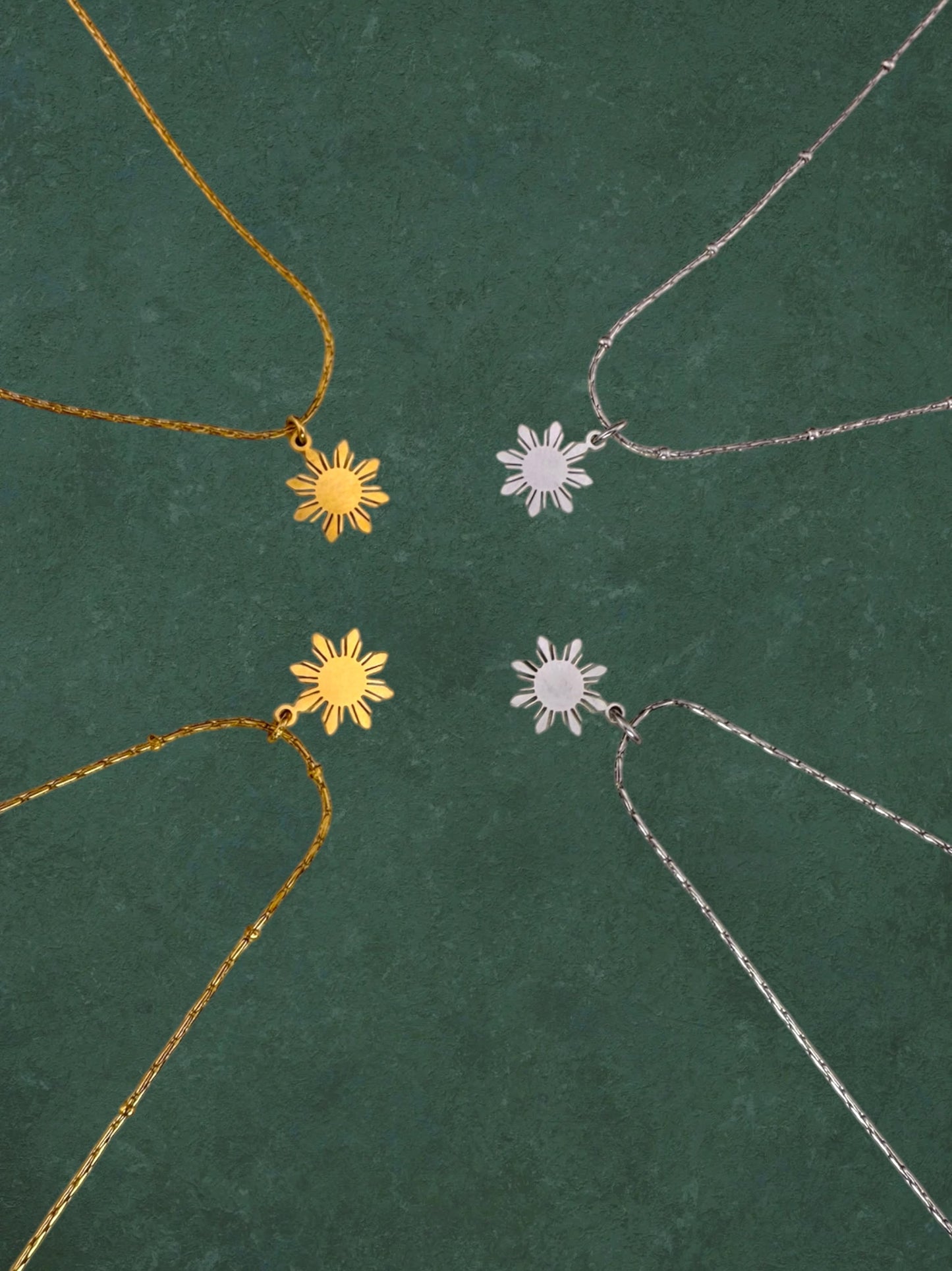 Aking Sinta Dainty Araw Necklace in silver and gold on dark green background, Philippine-inspired jewellery for diaspora abroad