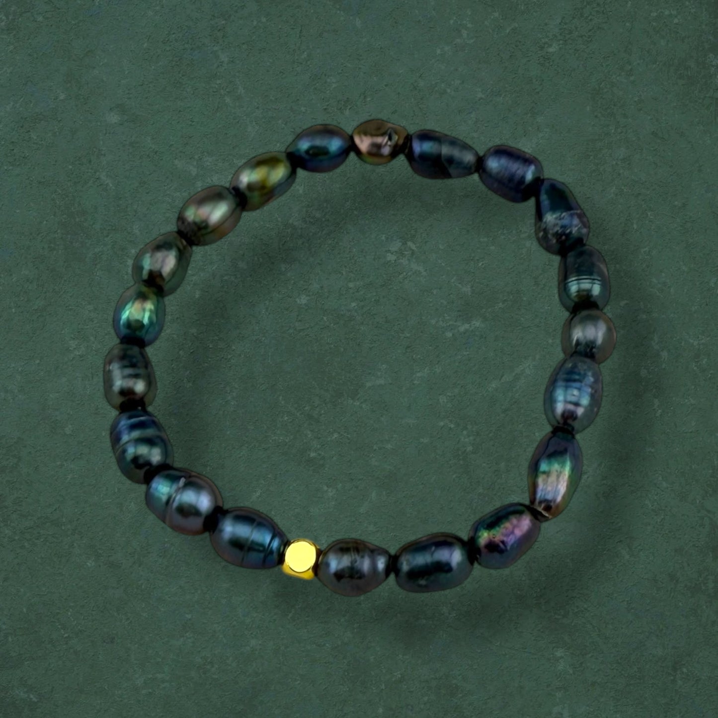 Aking Sinta Freshwater Pearl Stretch Bracelet with dark blue beads, no charm, displayed on dark green background, highlighting natural stone beads and stretch design