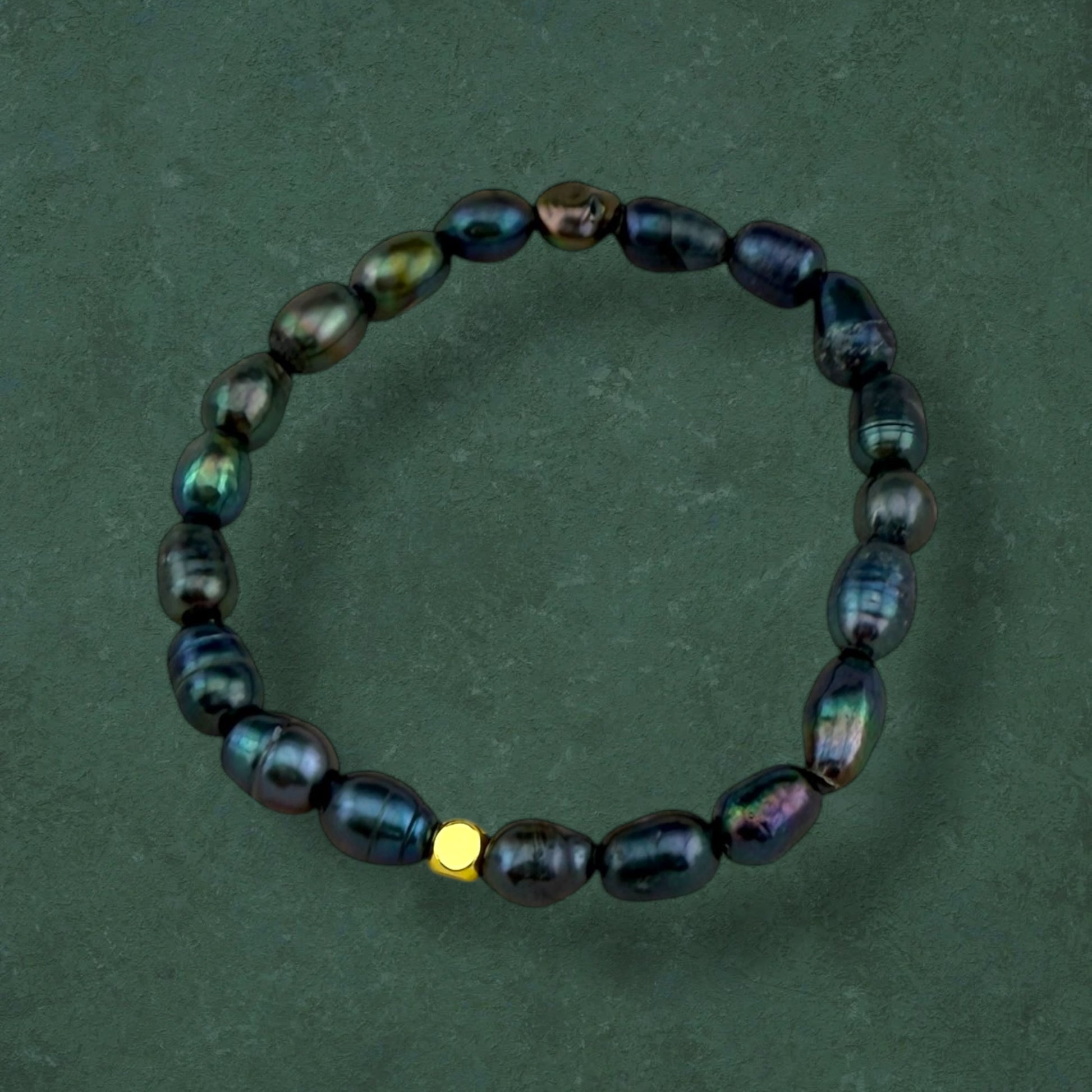 Aking Sinta Freshwater Pearl Stretch Bracelet with dark blue beads, no charm, displayed on dark green background, highlighting natural stone beads and stretch design