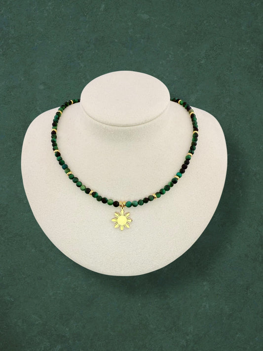 Aking Sinta Green Tiger Eye beaded necklace displayed on a white bust; featuring deep emerald-green gemstones with a silky, light-catching shimmer, accented with polished gold beads integrated into the strand and a central gold 8-ray Araw sun charm