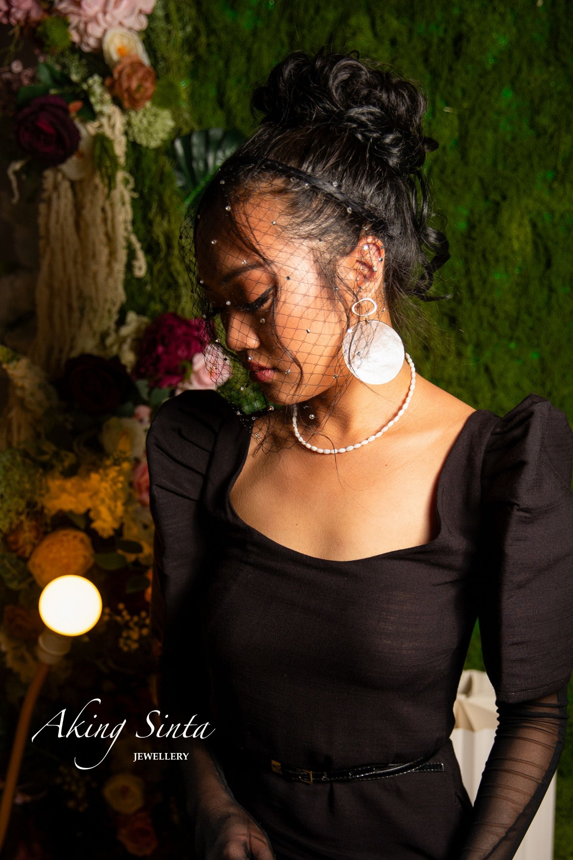 Aking Sinta Mother of Pearl Rice Necklace plain variant worn by female model in black dress, highlighting natural white beads and minimalist, Philippine-inspired design