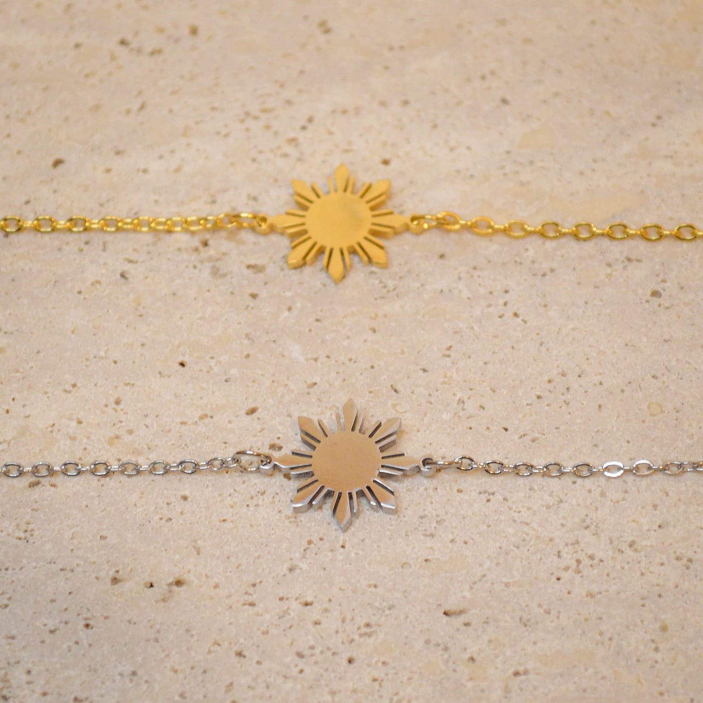 Araw minimalist bracelet with Philippine sun charm in 18K gold plated stainless steel, worn on hand as modern Filipino jewelry