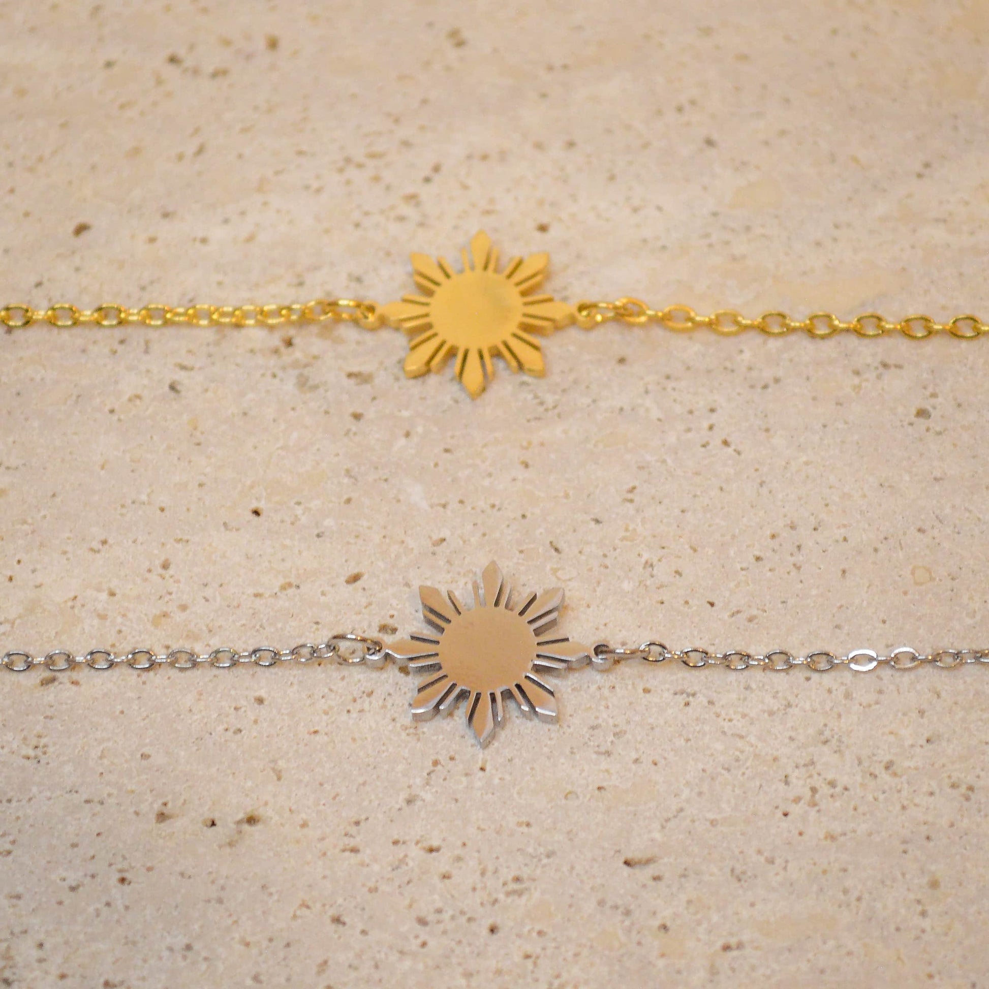 Araw minimalist bracelet with Philippine sun charm in 18K gold plated stainless steel, worn on hand as modern Filipino jewelry